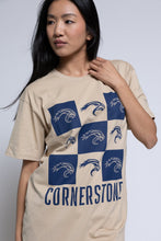 Load image into Gallery viewer, Woman wearing a beige t-shirt with a blue mascot checkered design and &#39;Cornerstone&#39; text.