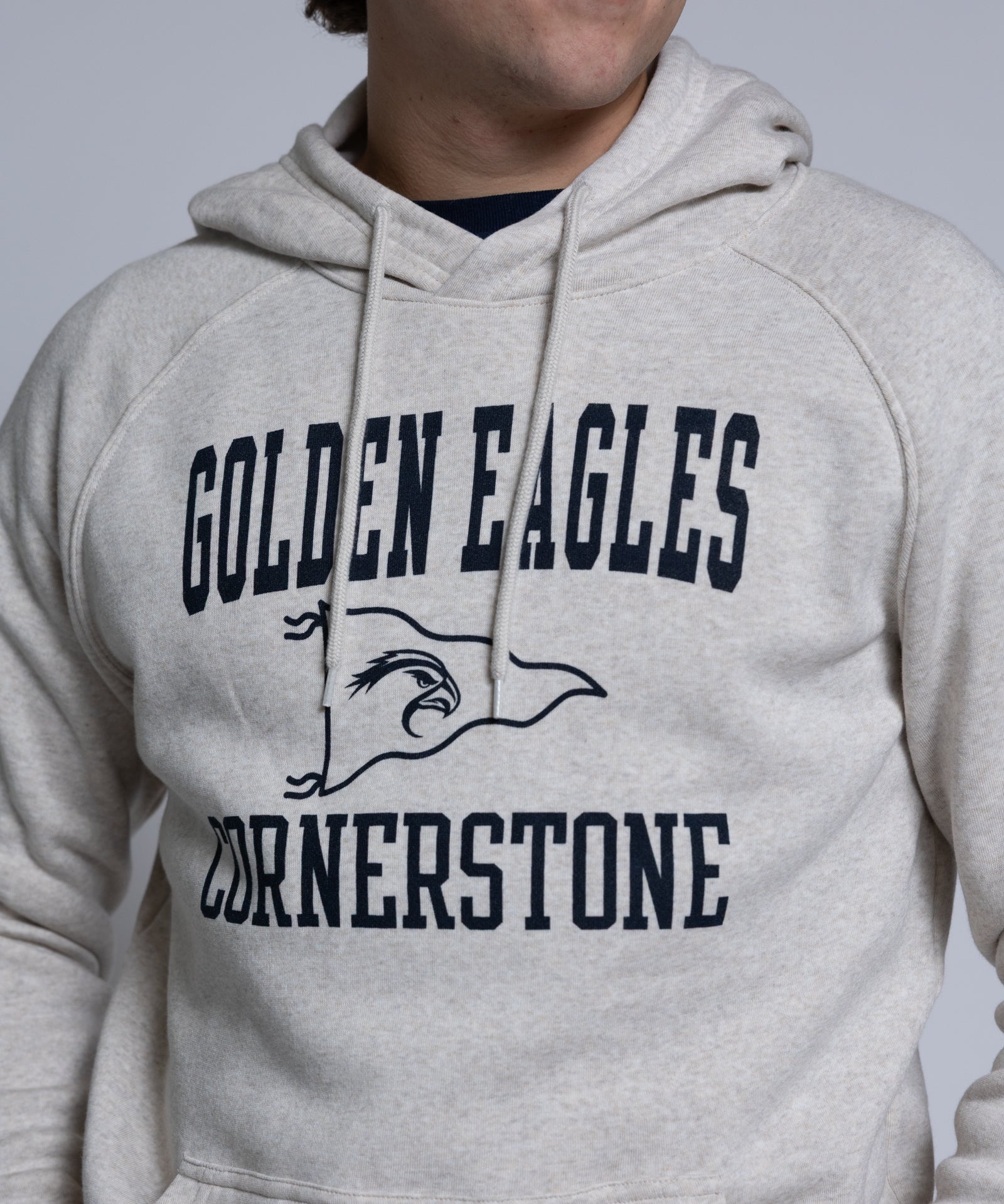 Person wearing a hoodie with 'Golden Eagles Cornerstone' text and logo.