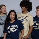 Four people wearing Cornerstone University nike apparel against a plain background