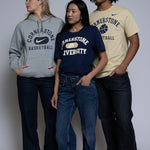 Three people wearing Cornerstone branded nike clothing on a plain background